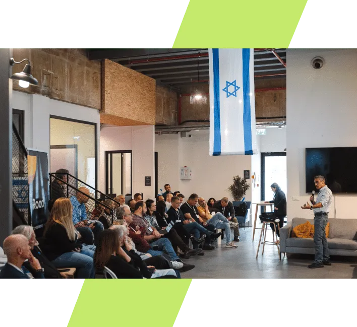 An i4Valley event in Karmiel: founders and industry guests listening to a talk